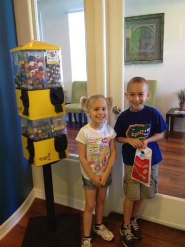 Kids smiling in front of the treasure tower